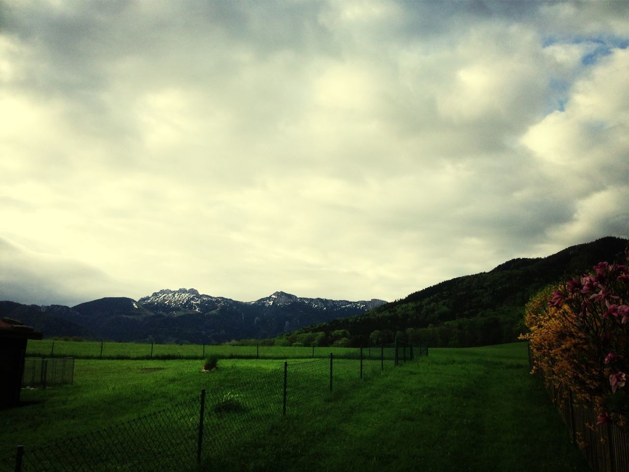 mountain, landscape, sky, tranquil scene, tranquility, scenics, mountain range, beauty in nature, cloud - sky, grass, field, cloudy, nature, fence, cloud, non-urban scene, grassy, rural scene, idyllic, remote