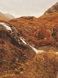 Scenic view of mountains against sky during autumn