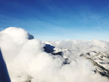 Scenic view of snow covered mountains against sky