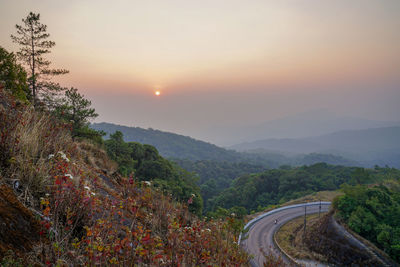 Scenic view of mountains against sky during sunset