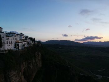 Panoramic view of buildings against sky during sunset