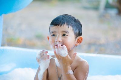 High angle view of boy in bathtub