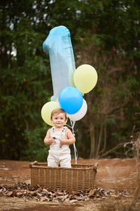 Full length of a boy holding umbrella