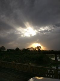 Scenic view of river against sky during sunset