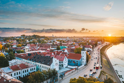 Aerial view of townscape against sky during sunset