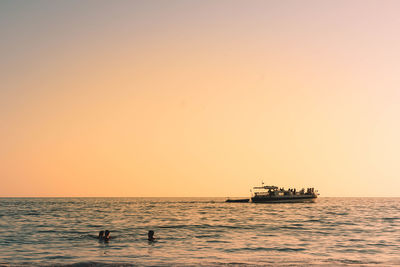 Scenic view of sea against clear sky during sunset