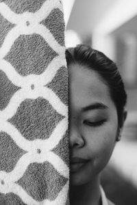 Close-up portrait of young woman with eyes closed