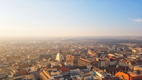 High angle view of city buildings against sky