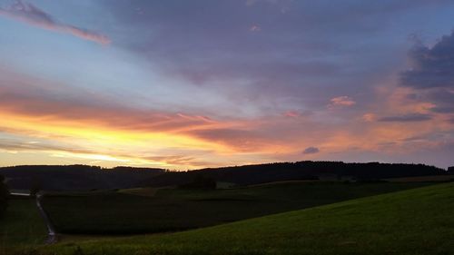 Scenic view of landscape at sunset