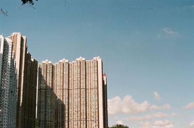 Low angle view of modern buildings against sky