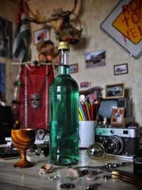 Close-up of wine bottles on table