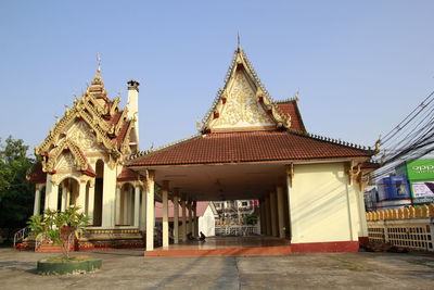 Exterior of temple building against clear sky