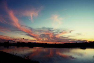 Scenic view of lake at sunset