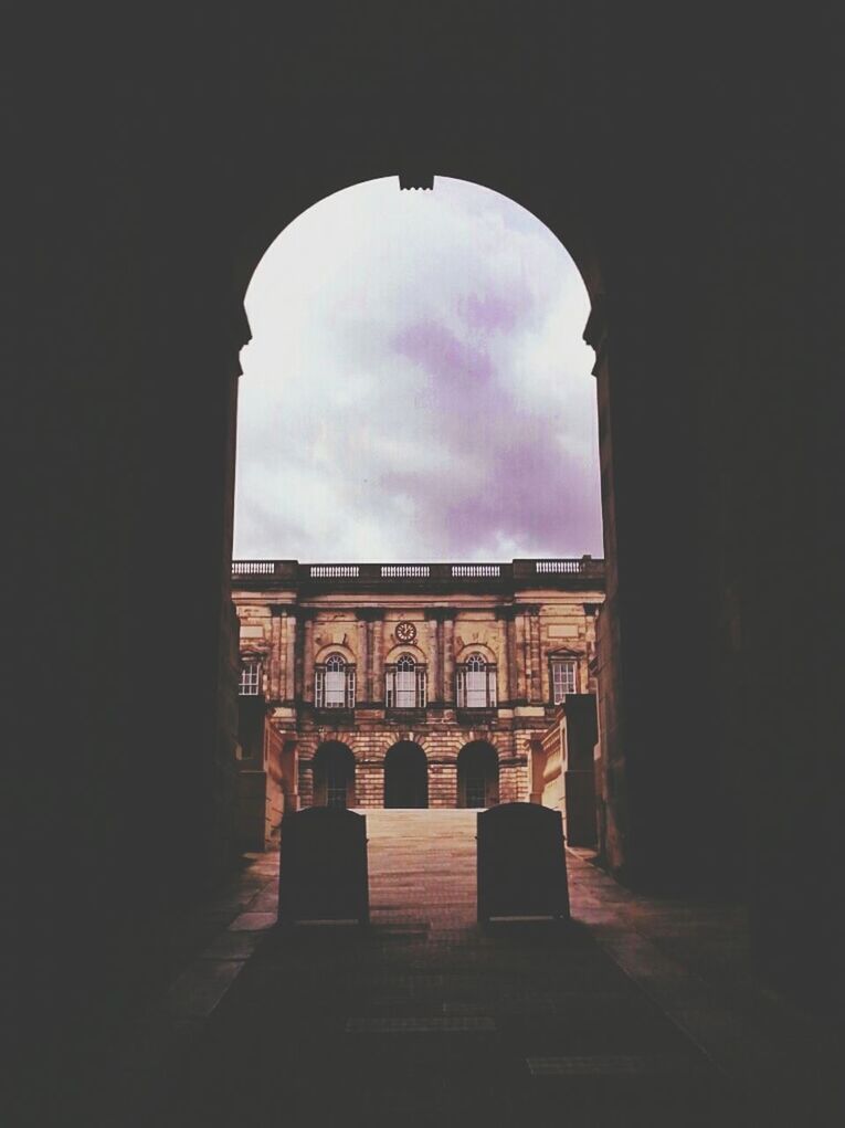 architecture, arch, built structure, sky, indoors, archway, building exterior, arched, history, cloud - sky, silhouette, building, low angle view, entrance, the way forward, architectural column, window, dark, cloud, no people