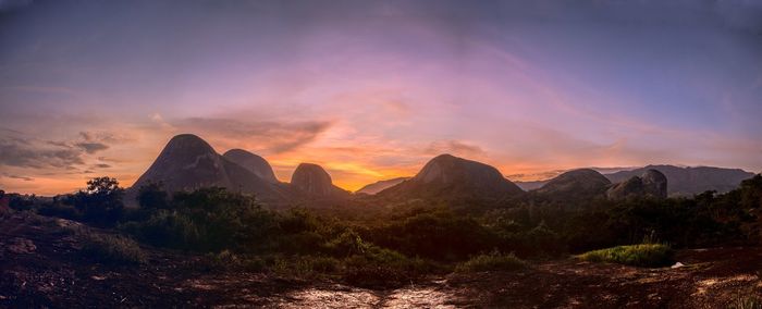 Scenic view of mountains against sky at sunset