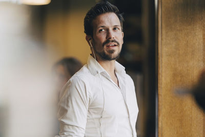 Portrait of young man looking at camera