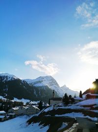 Scenic view of snow covered mountains against sky