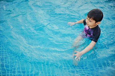 High angle view of boy in swimming pool