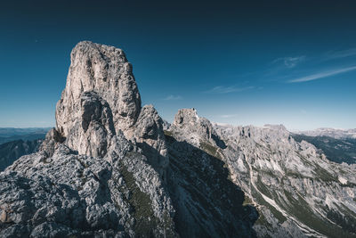 Rock formation on mountain against sky