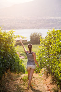 Full length of young woman standing on land