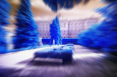 Blurred motion of illuminated lights in city at night