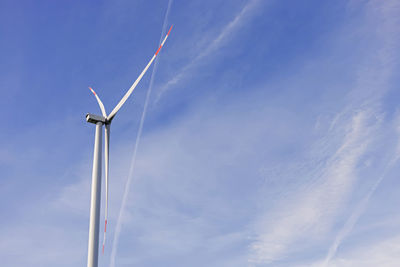 Windmill for electric power production against the blue sky. renewable energy