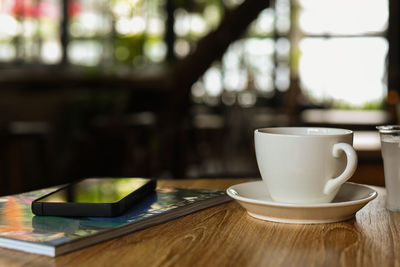 Close-up of coffee cup on table