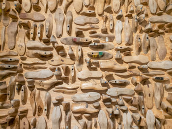 Full frame shot of shoe making carvings on wall