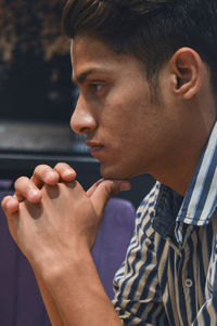 Close-up of young man looking away