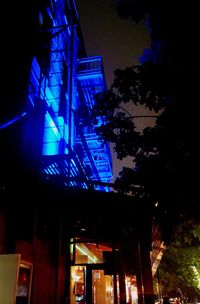 Low angle view of illuminated building at night