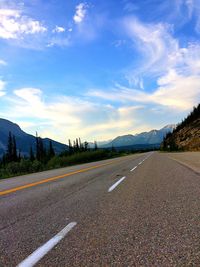 Empty road passing through landscape