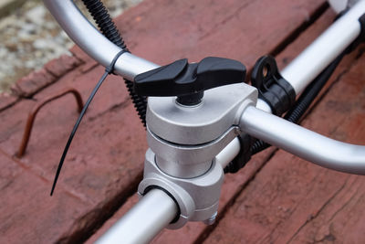 High angle view of bicycle parked against wall