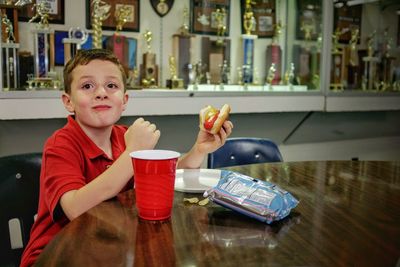 Boy eating hamburger 