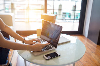 Man using laptop on table