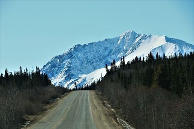 Panoramic view of snowcapped mountains against clear sky