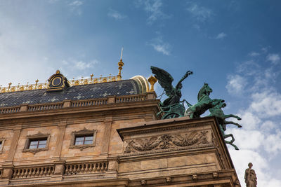 Detail of the national theatre building and prague city old town