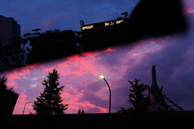 Low angle view of silhouette trees against sky at sunset