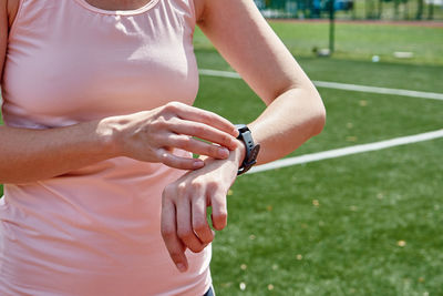 Woman use fitness smart watch, checking results after sport training