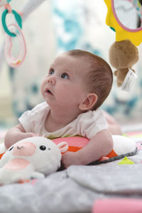 Portrait of cute baby girl with toy