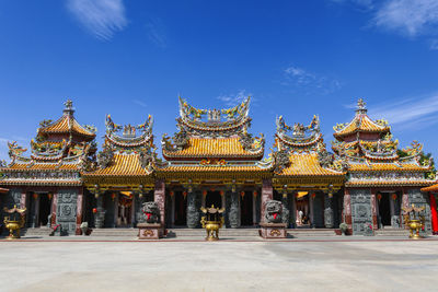 View of temple building against blue sky