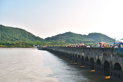 Bridge over river against clear sky