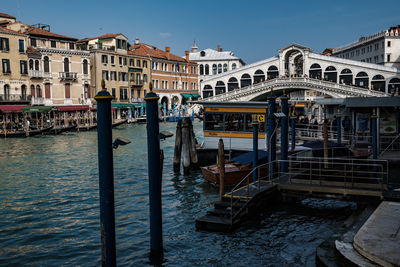 View of boats in canal against buildings