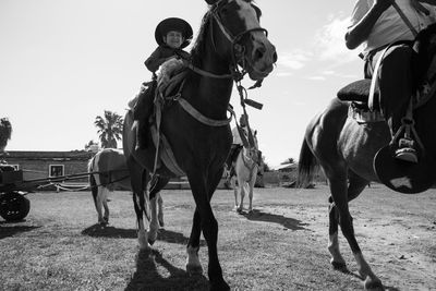 People riding horses in south america