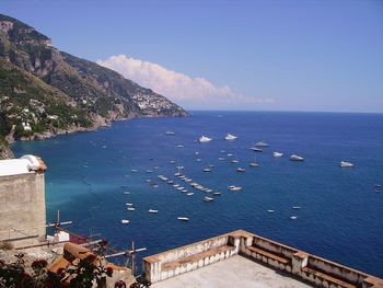 High angle view of sea and buildings against sky