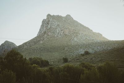 Scenic view of rocky mountains against clear sky