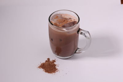 Close-up of coffee cup against white background