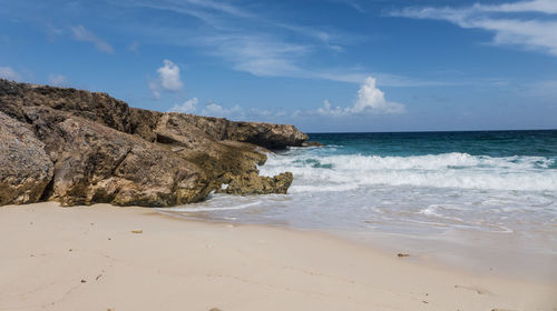 Scenic view of beach and sea against sky