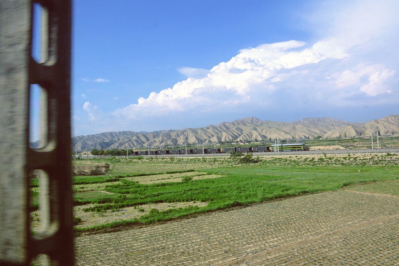 mountain, landscape, field, agriculture, sky, day, no people, nature, scenics, mountain range, rural scene, beauty in nature, outdoors, grass