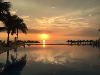 Scenic view of swimming pool against sky during sunset in mexico 