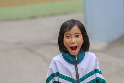 A vietnamese young little cute girl is laughing with decayed teeth